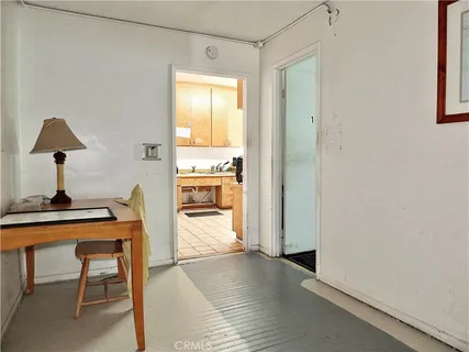 a view of a room with a table and a chair