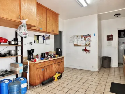 a view of kitchen and living room with a wooden floor