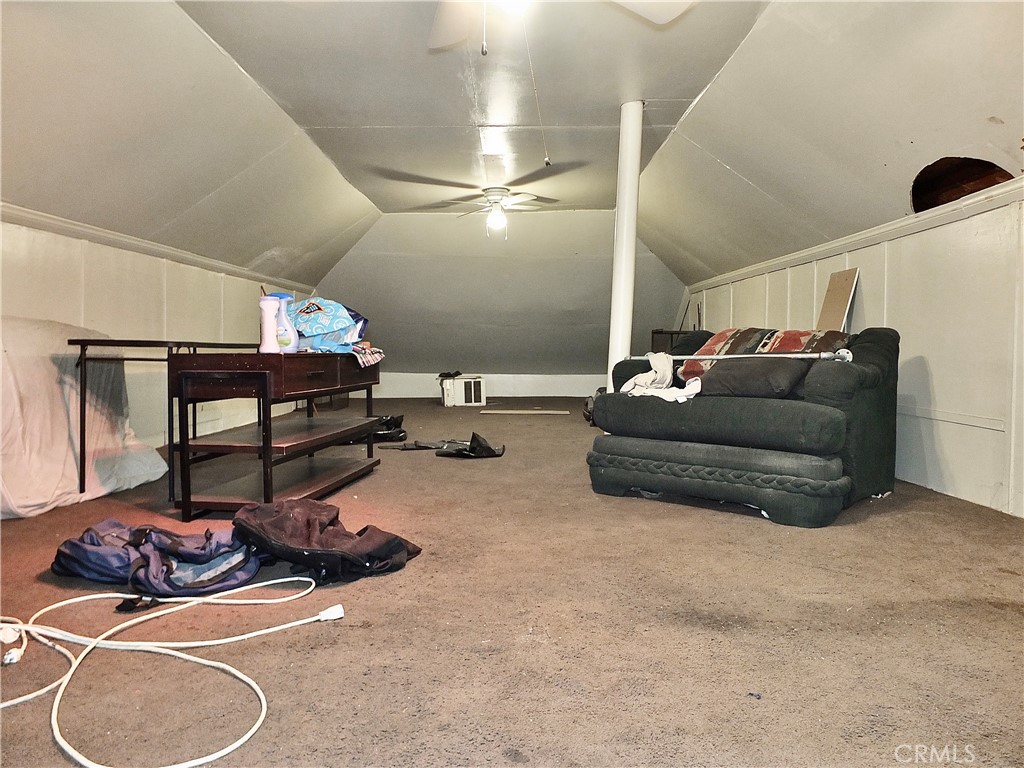 836 Atlantic Avenue Long Beach, CA 90813 - Photo 25 of 27 a living room with hard wood floor furniture and gym equipment
