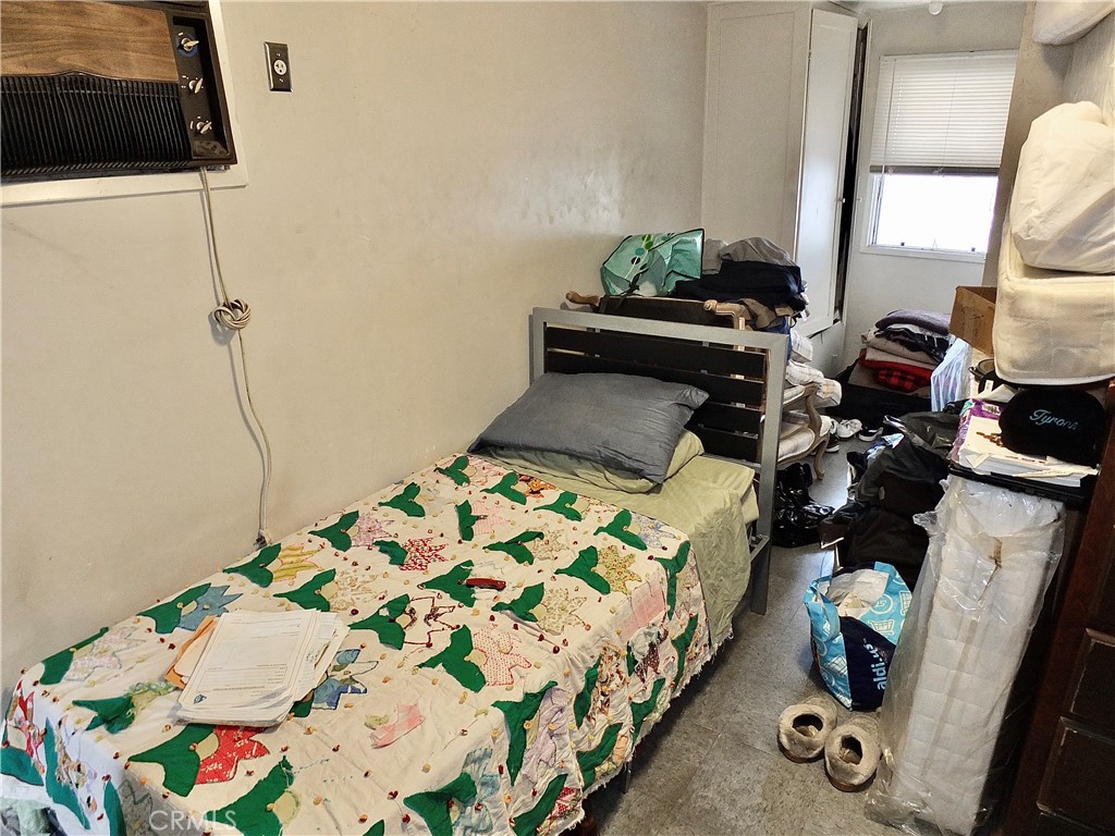 836 Atlantic Avenue Long Beach, CA 90813 - Photo 27 of 27 a bedroom with a bed and wooden floor