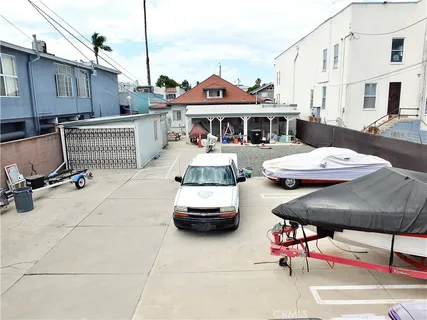 a front view of a building with table and chairs