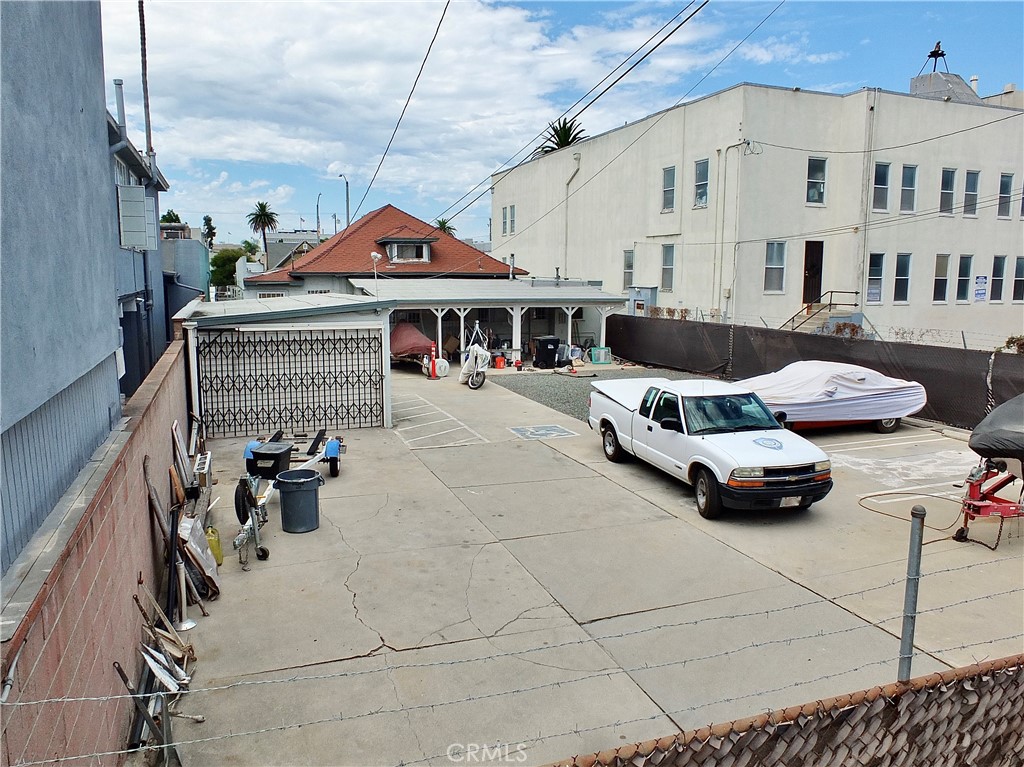 836 Atlantic Avenue Long Beach, CA 90813 - Photo 4 of 27 a roof deck with couches and potted plants
