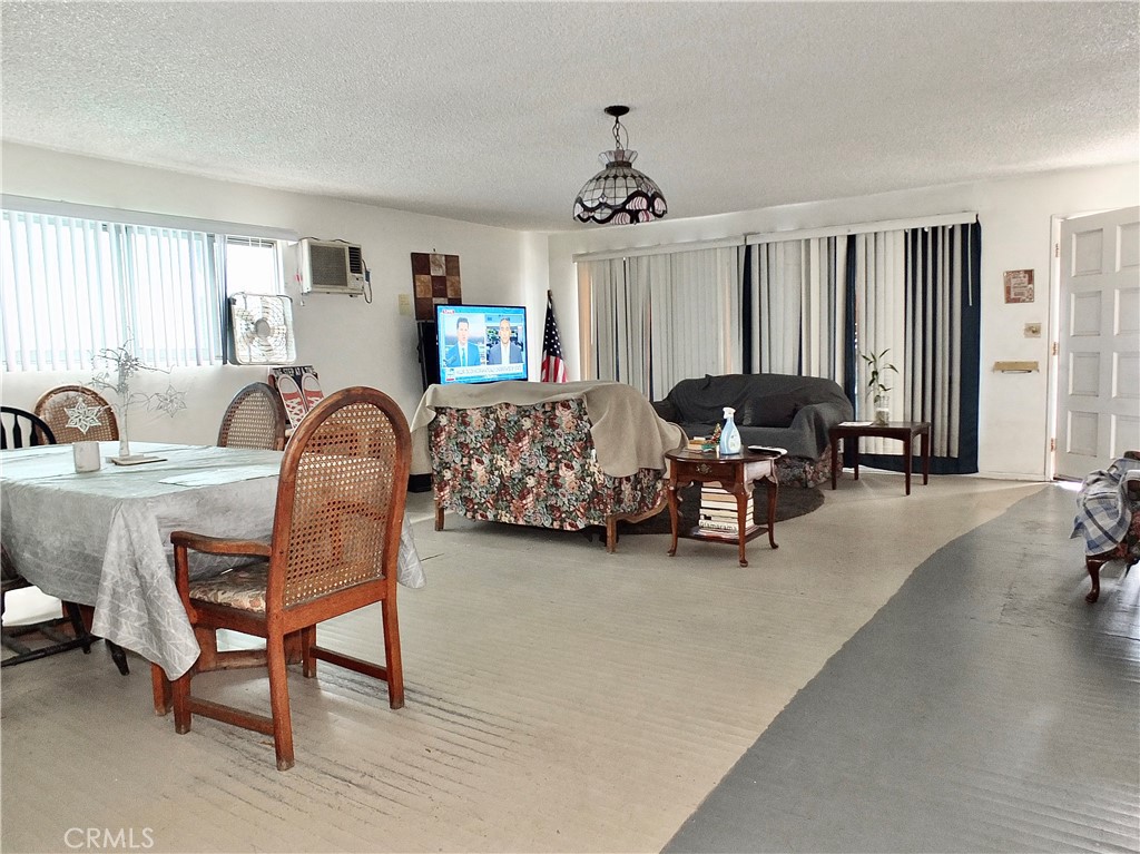 836 Atlantic Avenue Long Beach, CA 90813 - Photo 7 of 27 a living room with furniture and a chandelier