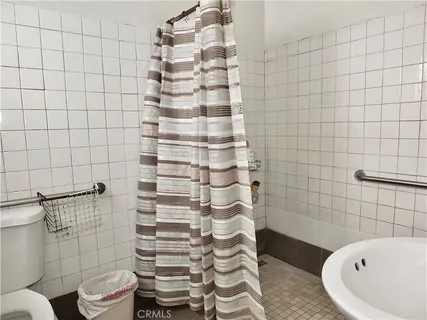 a bathroom with a sink and toilet