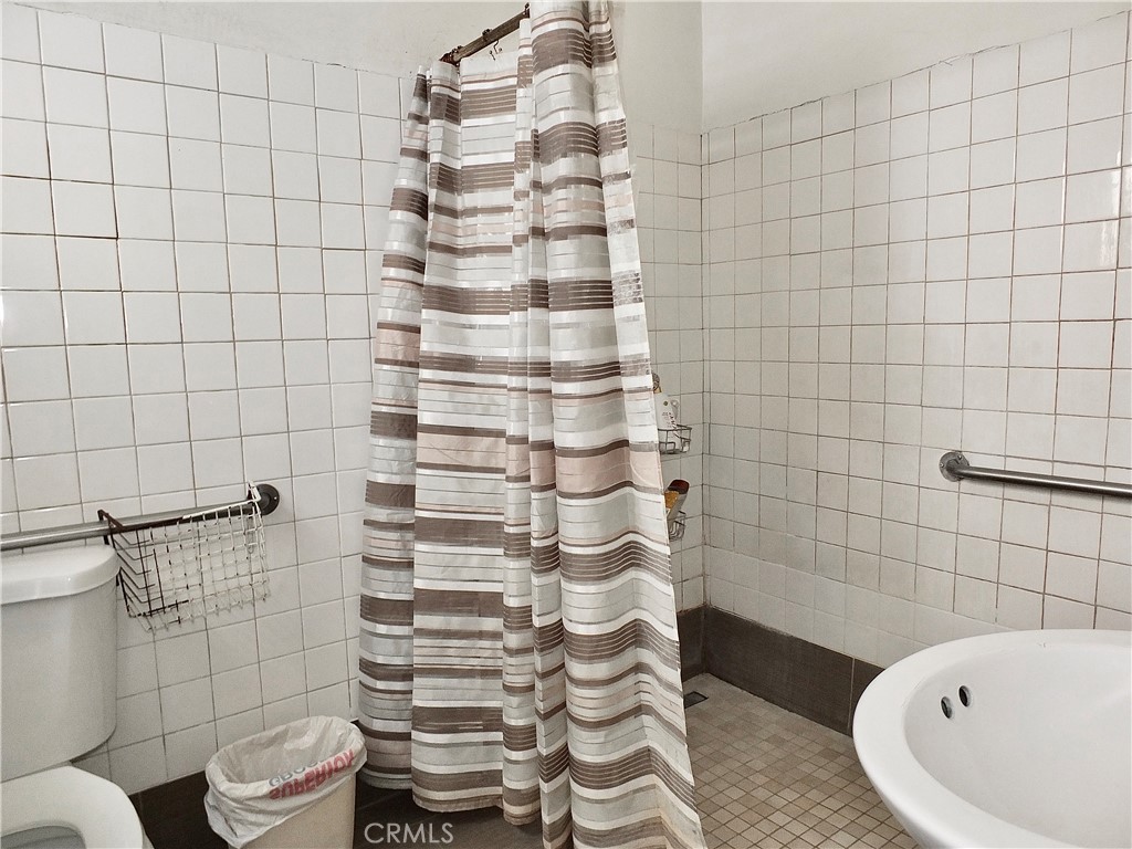 836 Atlantic Avenue Long Beach, CA 90813 - Photo 10 of 27 a bathroom with a sink and toilet