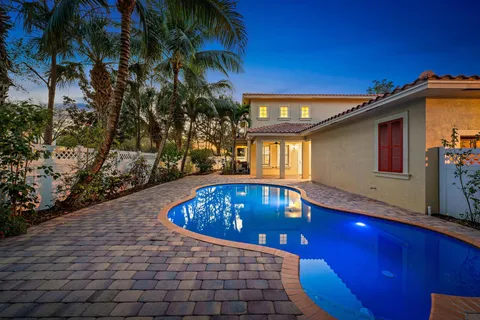 a house view with a backyard space