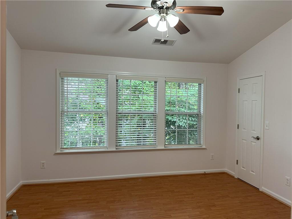 4162 Howell Park Road Duluth, GA 30096 - Photo 12 of 16 a view of an empty room with a window
