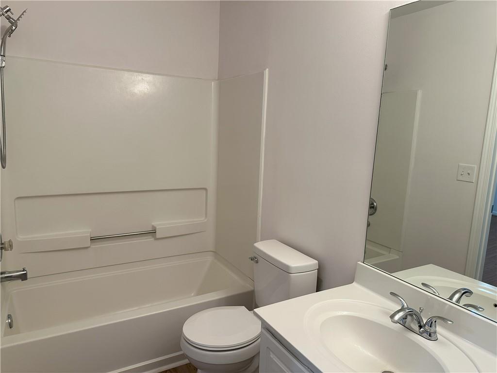 4162 Howell Park Road Duluth, GA 30096 - Photo 13 of 16 a bathroom with a sink a toilet and shower