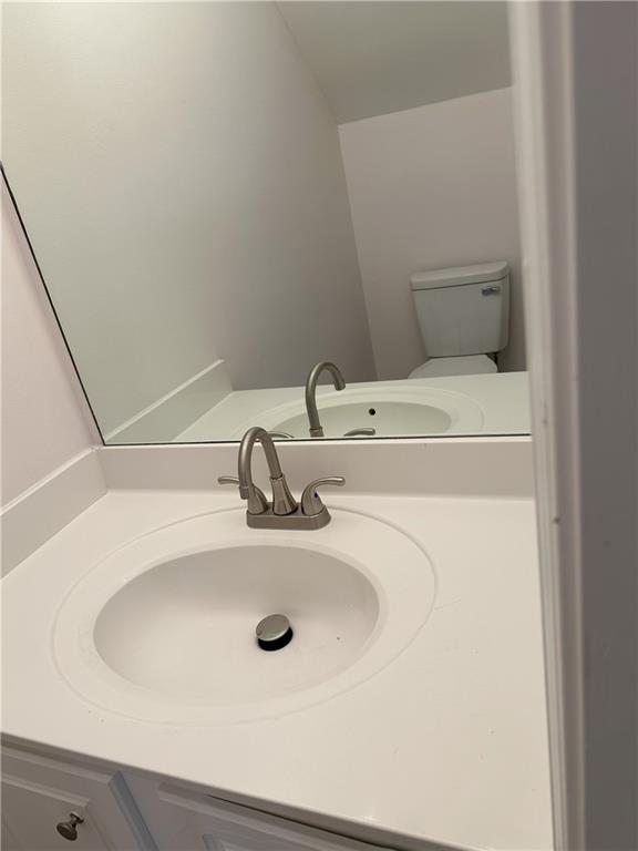 4162 Howell Park Road Duluth, GA 30096 - Photo 14 of 16 a bathroom with a sink and a mirror