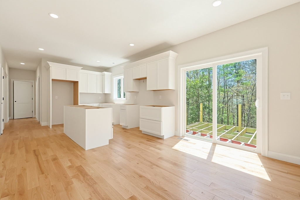 112 West Meadow Road Townsend, MA 01474 - Photo 3 of 38 a view of a kitchen with wooden floor and electronic appliances