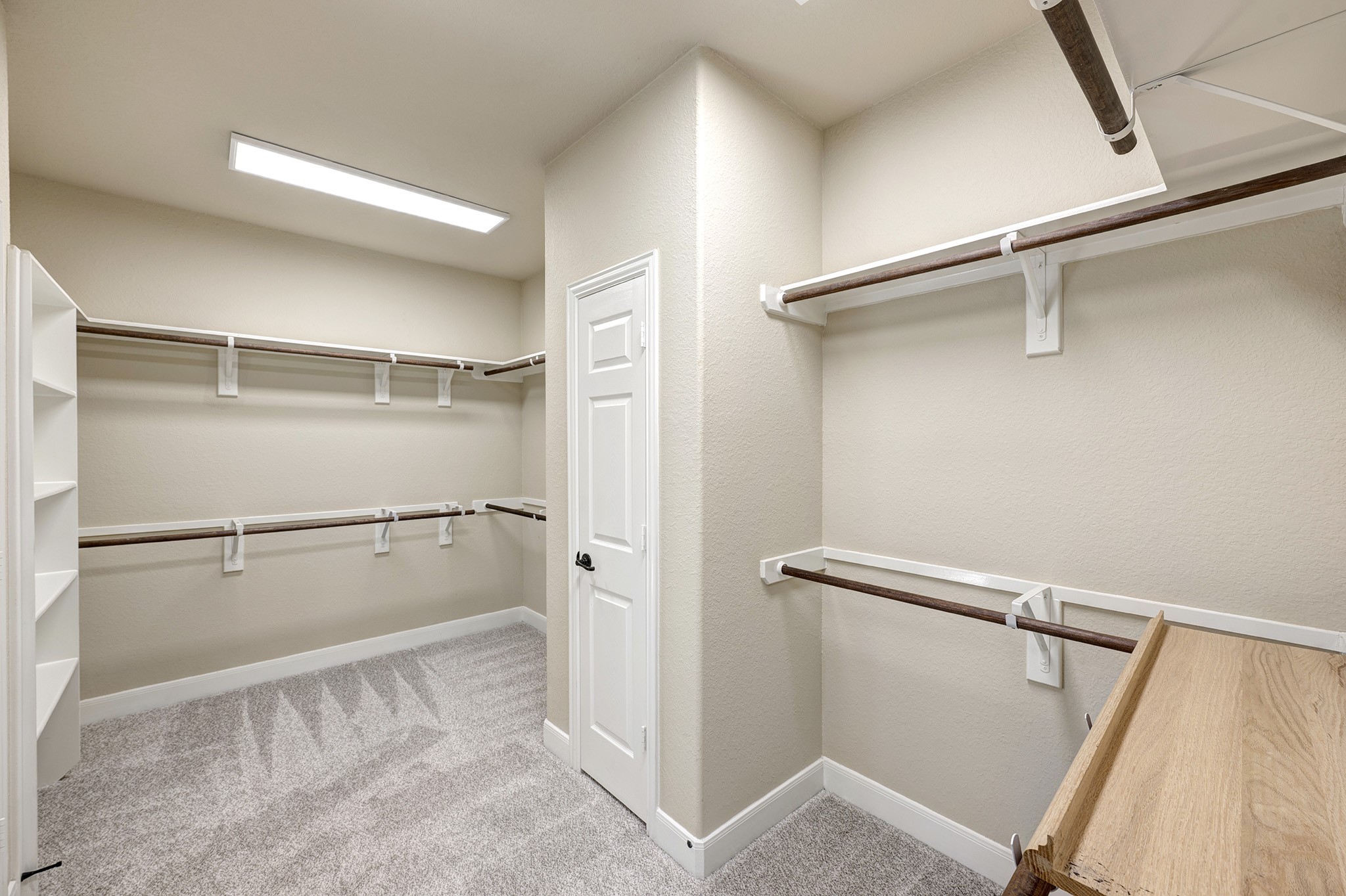 11 Red Wagon Drive Spring, TX 77389 - Photo 17 of 32 The primary closet includes a separate linen closet, double rods, and built-in shelving. And this is just the first half!