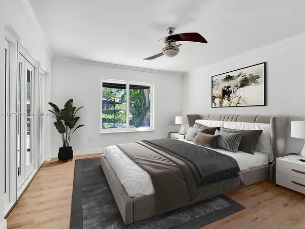 a bedroom with bed and a window