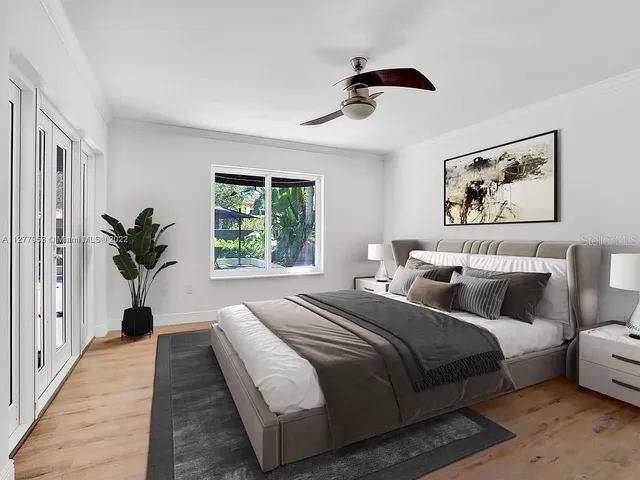 a bedroom with bed and a window