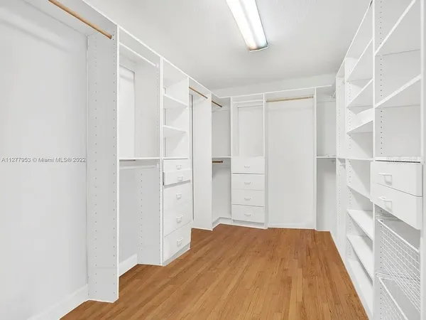 a bedroom with a bed and a closet