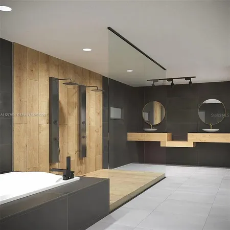 a kitchen with stainless steel appliances kitchen island sink stove and cabinets