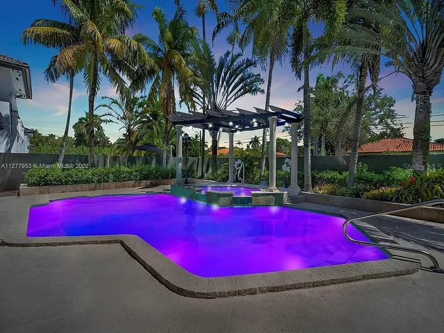 a view of a table and chairs in patio of a house