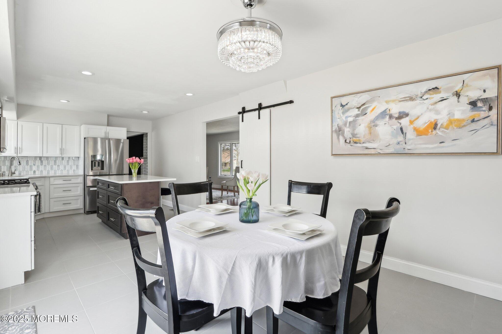 572 Line Road Hazlet, NJ 07730 - Photo 14 of 39 a view of a dining room with furniture and wooden floor