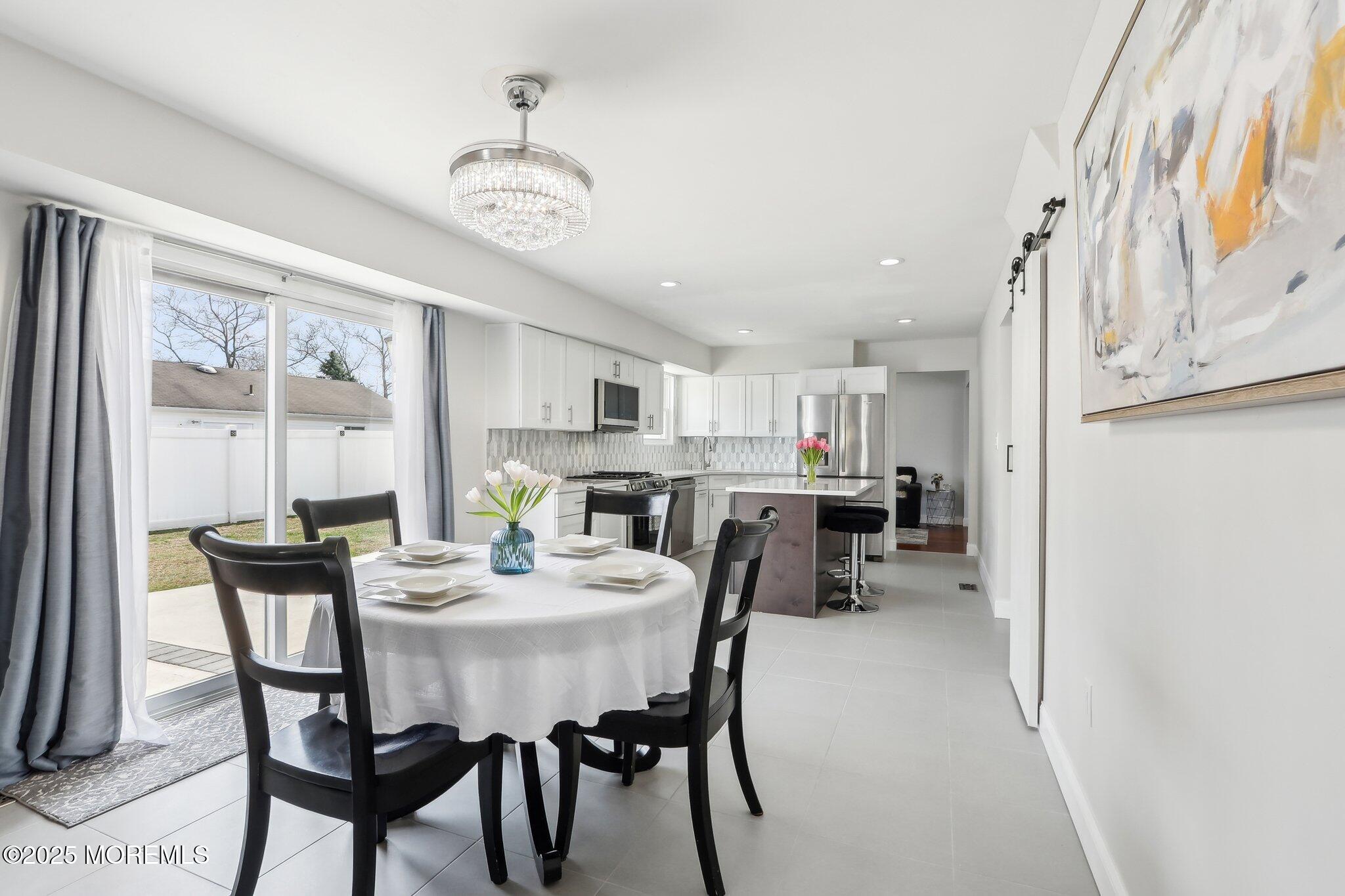 572 Line Road Hazlet, NJ 07730 - Photo 15 of 39 a view of a dining room with furniture and a large window