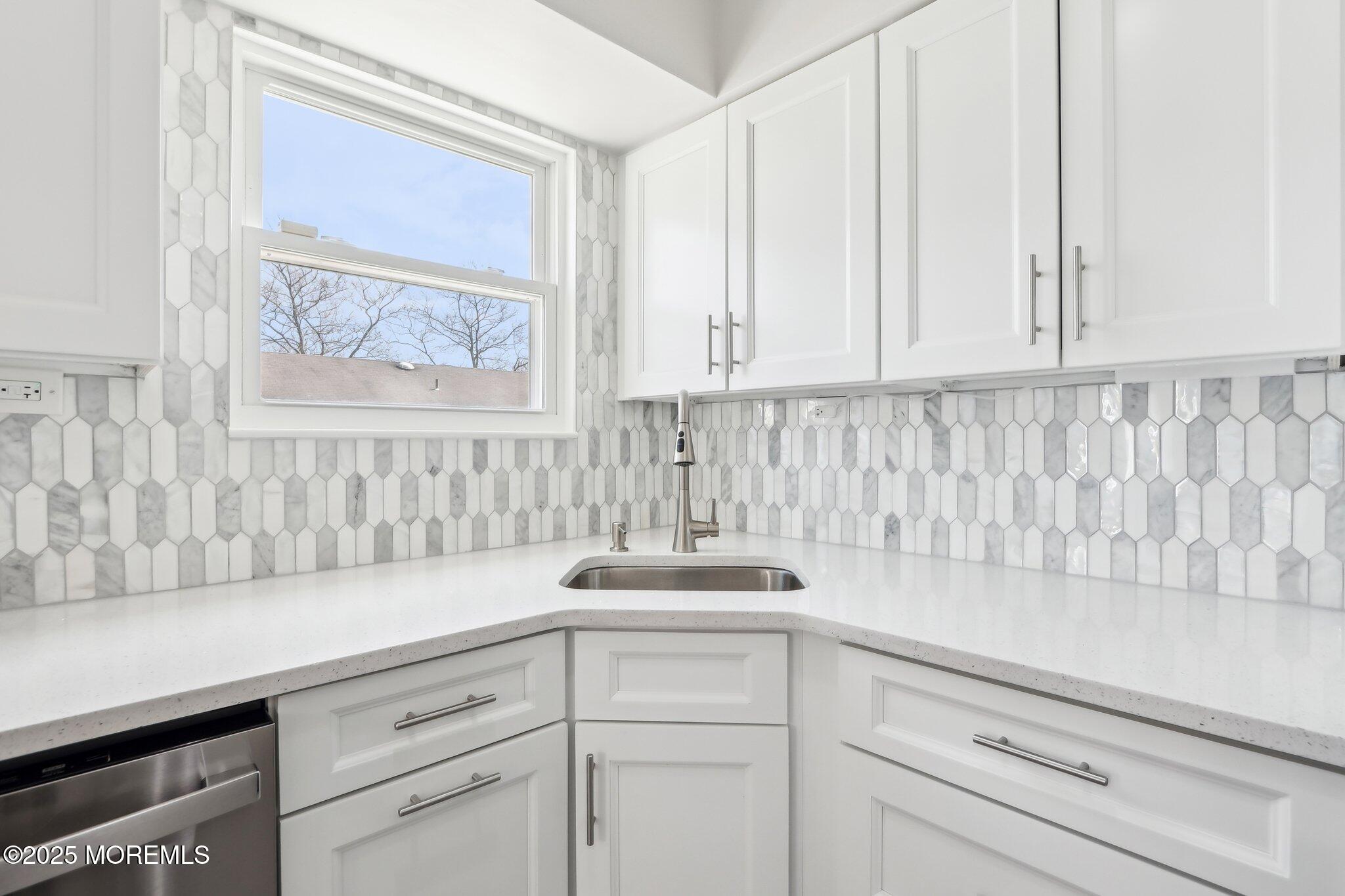 572 Line Road Hazlet, NJ 07730 - Photo 18 of 39 a bathroom with a sink and cabinets