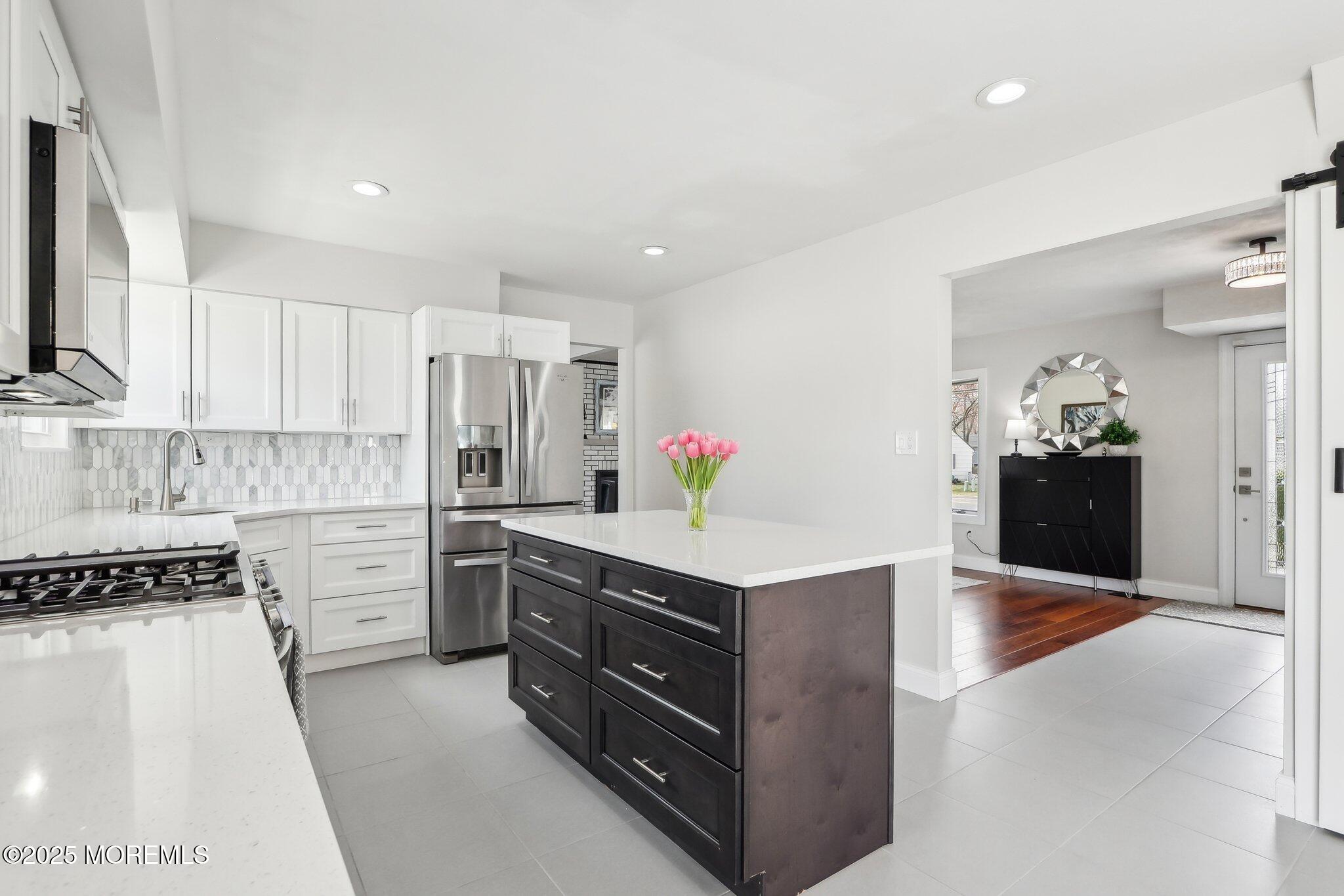572 Line Road Hazlet, NJ 07730 - Photo 20 of 39 a kitchen with a sink and white cabinets