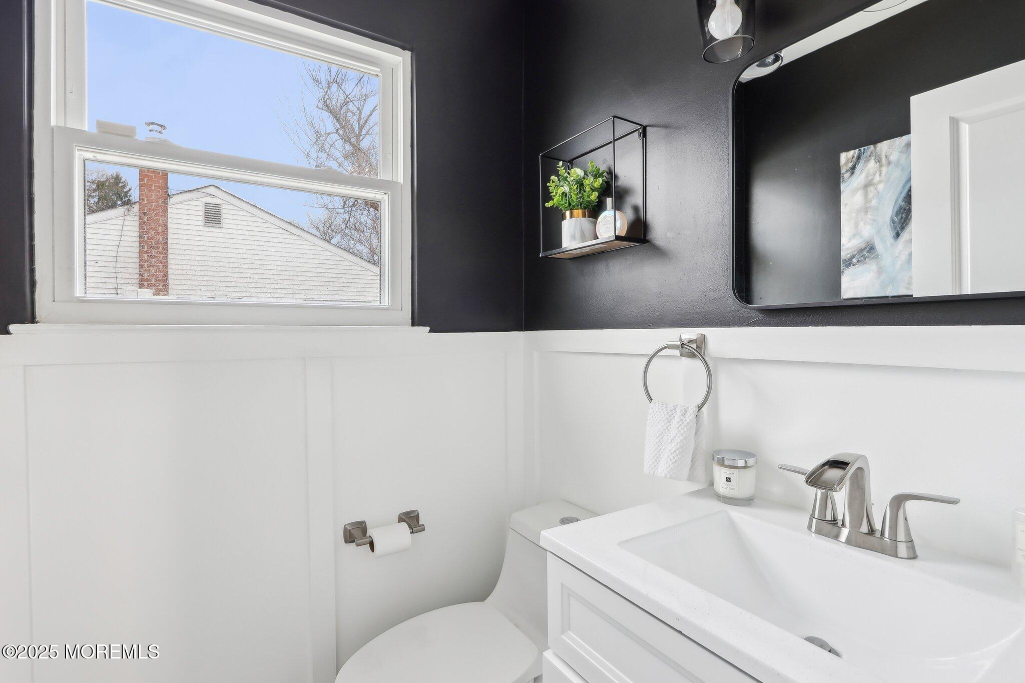572 Line Road Hazlet, NJ 07730 - Photo 24 of 39 a bathroom with a toilet sink and mirror