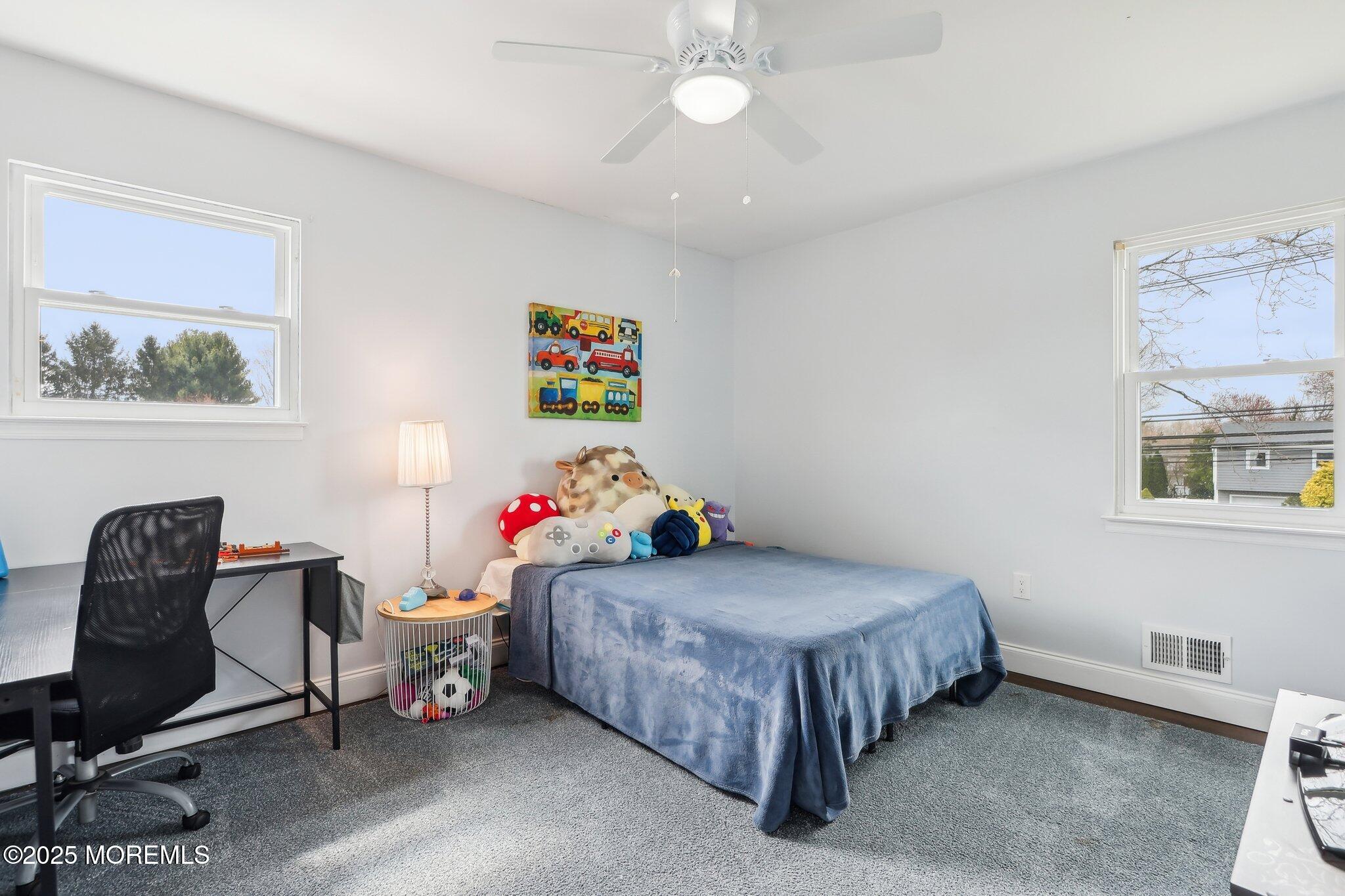 572 Line Road Hazlet, NJ 07730 - Photo 27 of 39 a bedroom with a bed and a desk