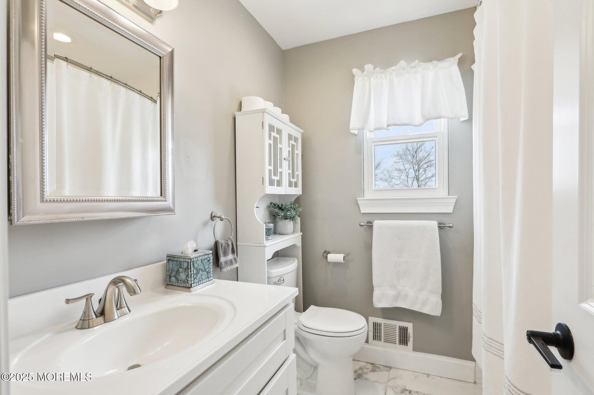 572 Line Road Hazlet, NJ 07730 - Photo 29 of 39 a bathroom with a sink toilet and shower