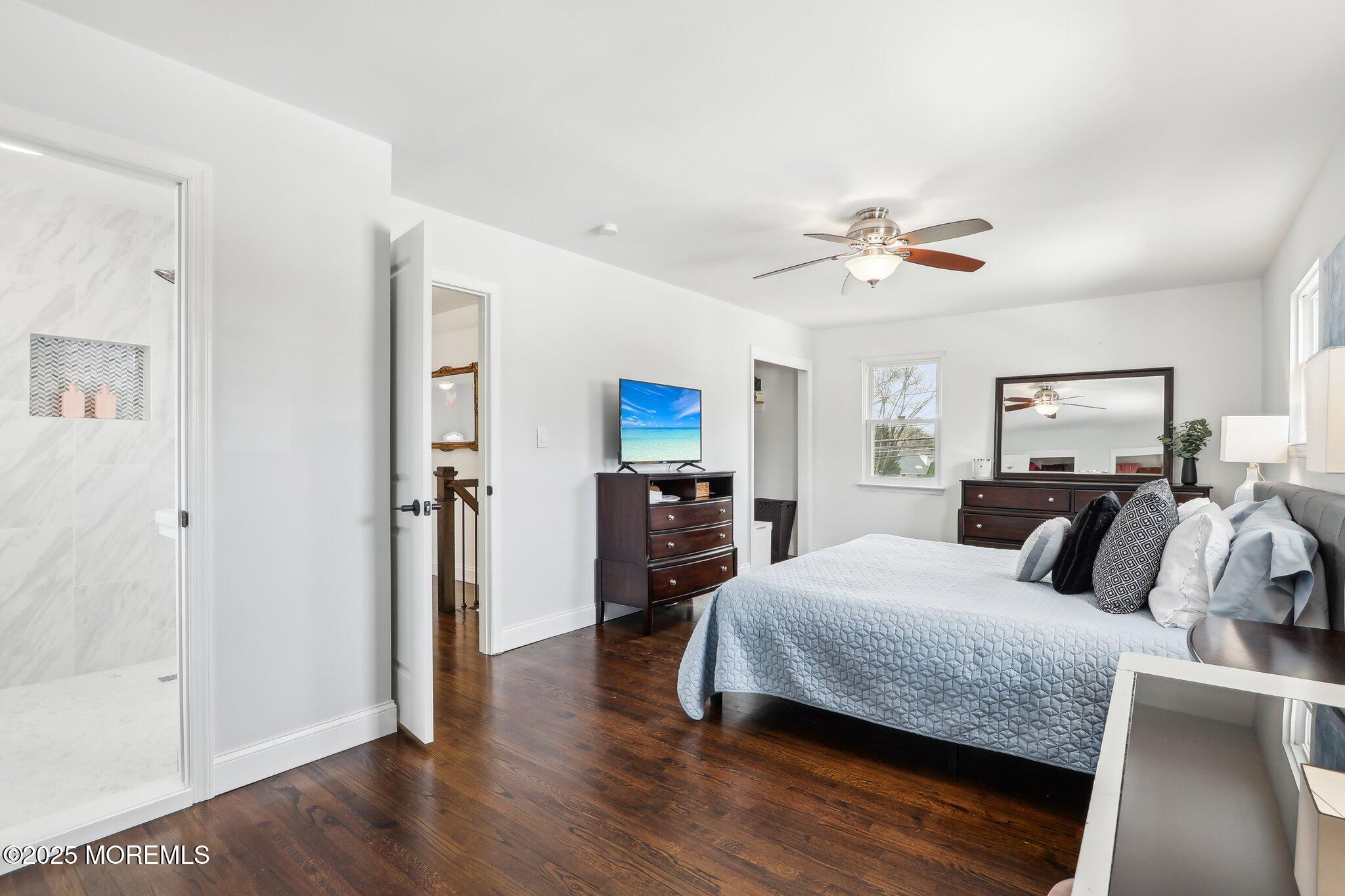 572 Line Road Hazlet, NJ 07730 - Photo 31 of 39 a bedroom with a bed and wooden floor