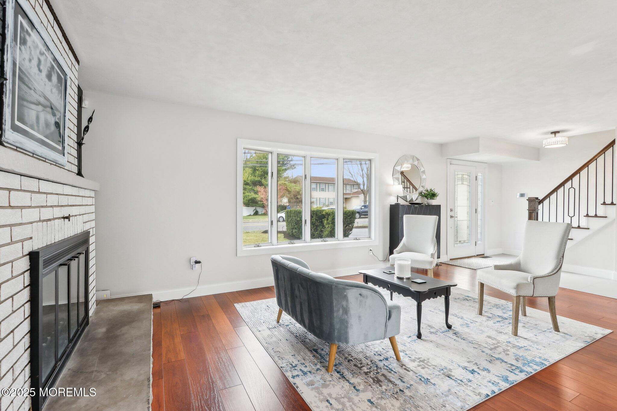 572 Line Road Hazlet, NJ 07730 - Photo 5 of 39 a living room with furniture and a wooden floor
