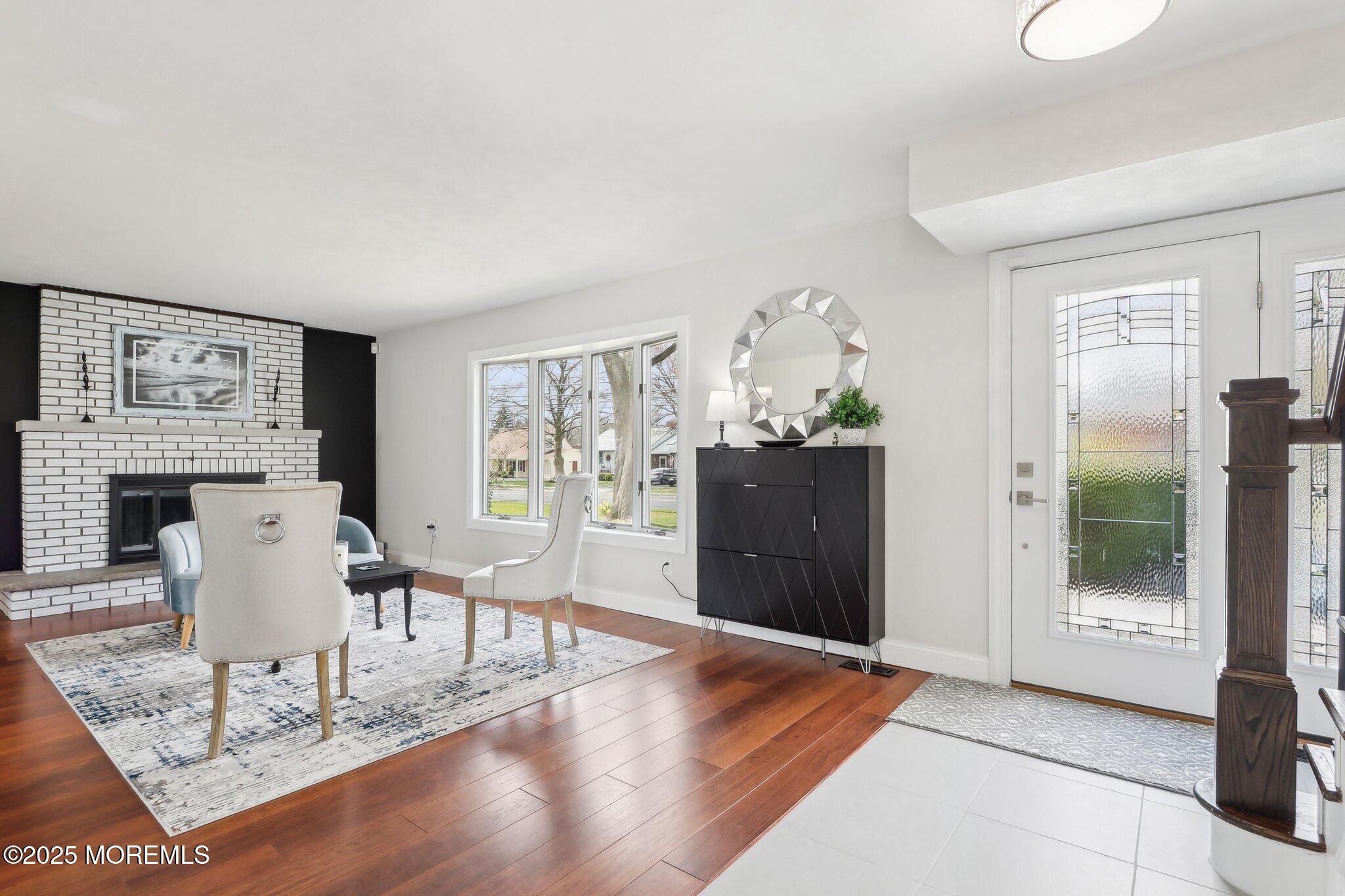 572 Line Road Hazlet, NJ 07730 - Photo 6 of 39 a living room with furniture a large window and wood floor