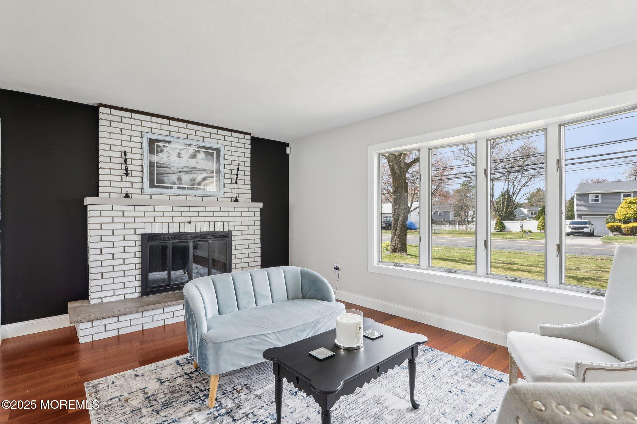 572 Line Road Hazlet, NJ 07730 - Photo 7 of 39 a living room with furniture and a fireplace
