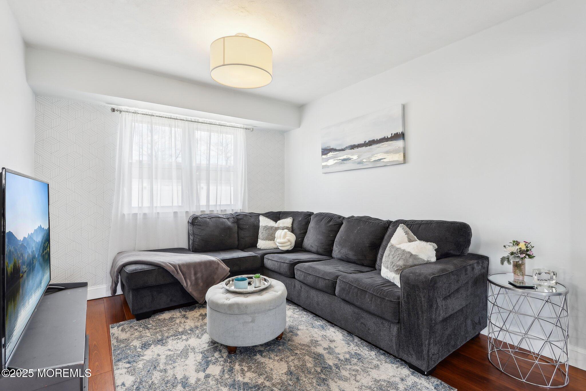 572 Line Road Hazlet, NJ 07730 - Photo 8 of 39 a living room with furniture and a flat screen tv