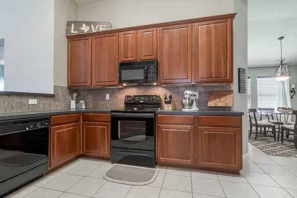 a kitchen with a cabinets and appliances