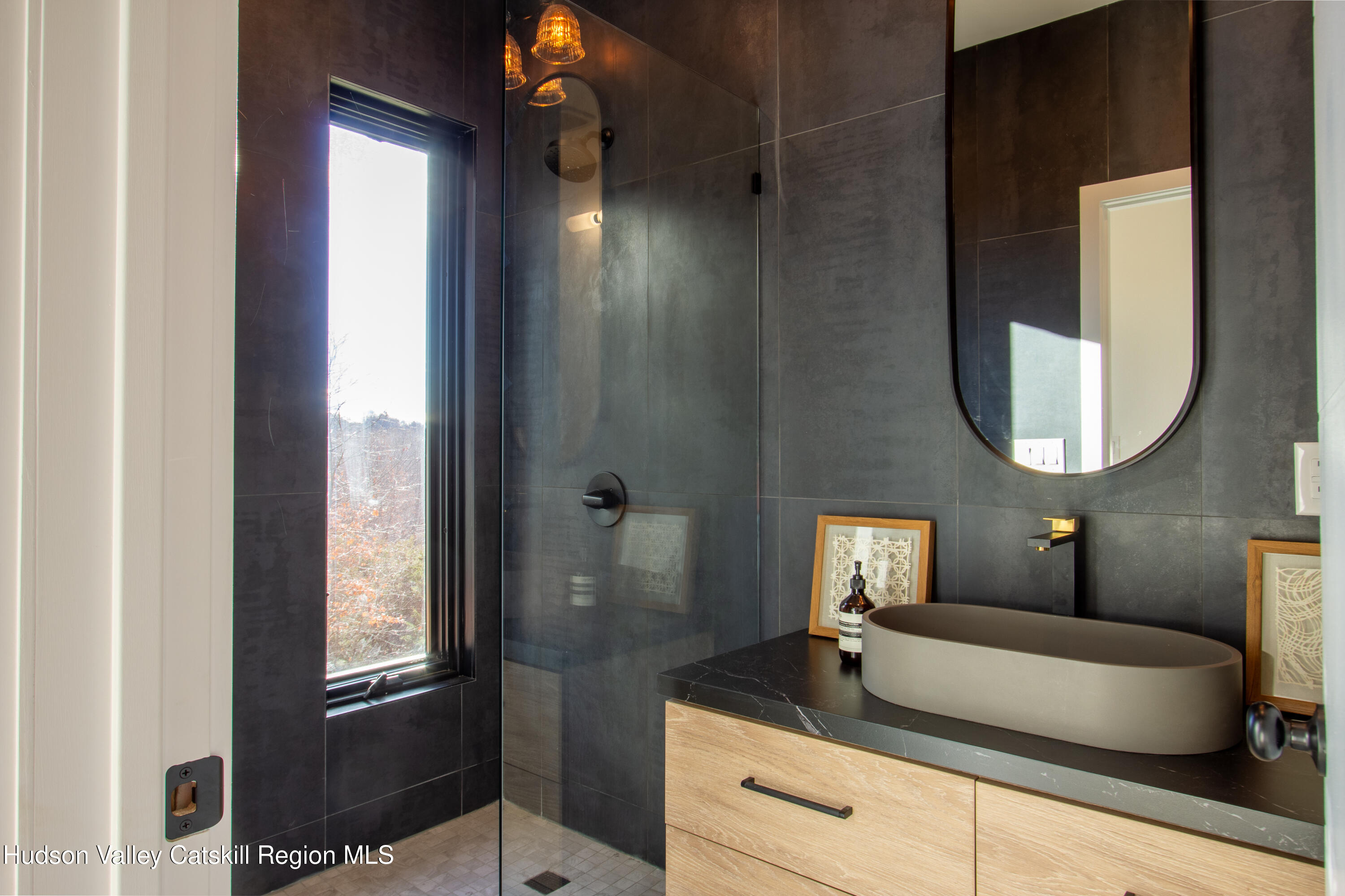 490 Old Rte 82 Elizaville, NY 12523 - Photo 13 of 26 a bathroom with a sink a mirror and a shower