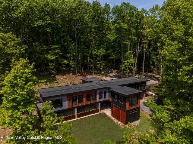 a view of a green field with lots of bushes