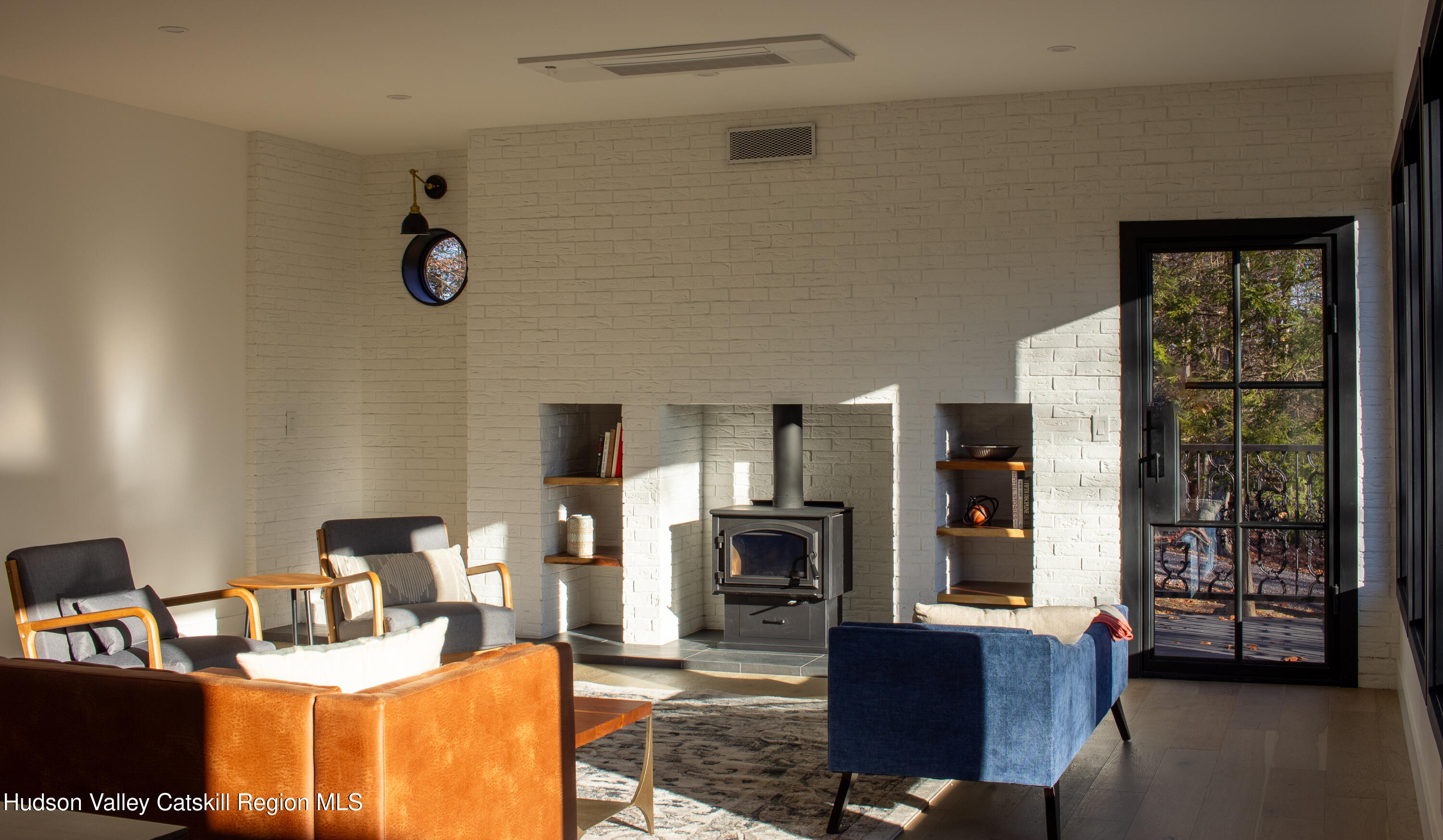 490 Old Rte 82 Elizaville, NY 12523 - Photo 7 of 26 a living room with fireplace furniture and a flat screen tv