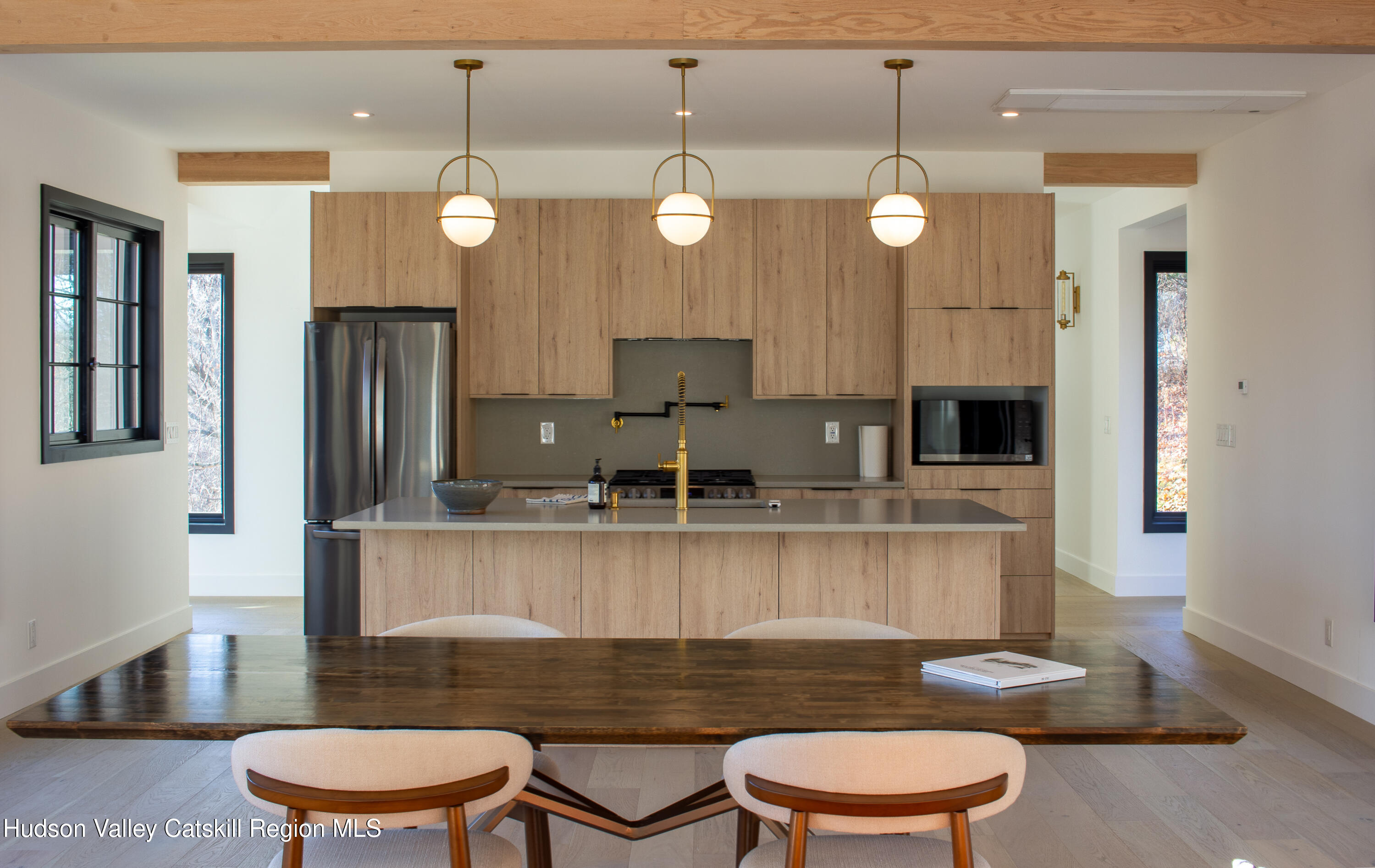 490 Old Rte 82 Elizaville, NY 12523 - Photo 8 of 26 a kitchen with a table chairs stove and wooden floor