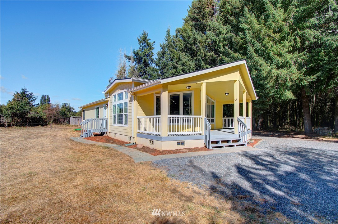 595 Nevil Road Winlock, WA 98596 - Photo 1 of 34 a view of a house with a yard and sitting area