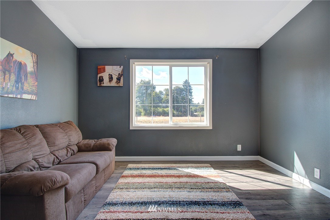 595 Nevil Road Winlock, WA 98596 - Photo 14 of 34 a bedroom with a bed and a couch