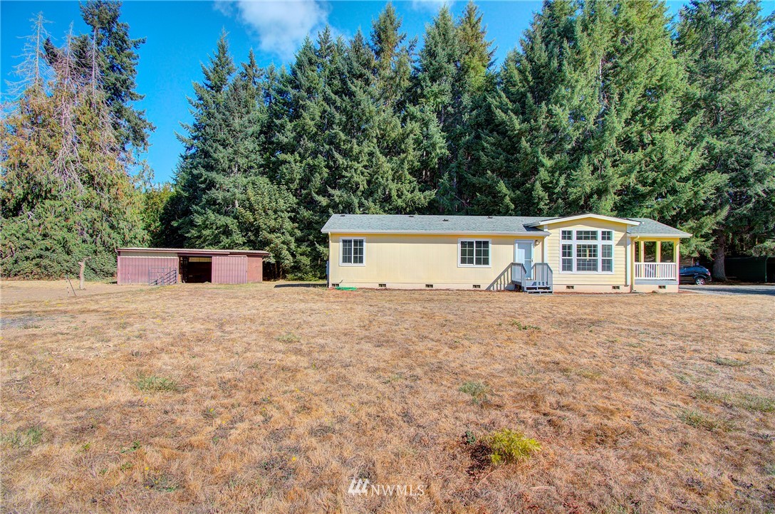 595 Nevil Road Winlock, WA 98596 - Photo 3 of 34 a front view of a house with a yard