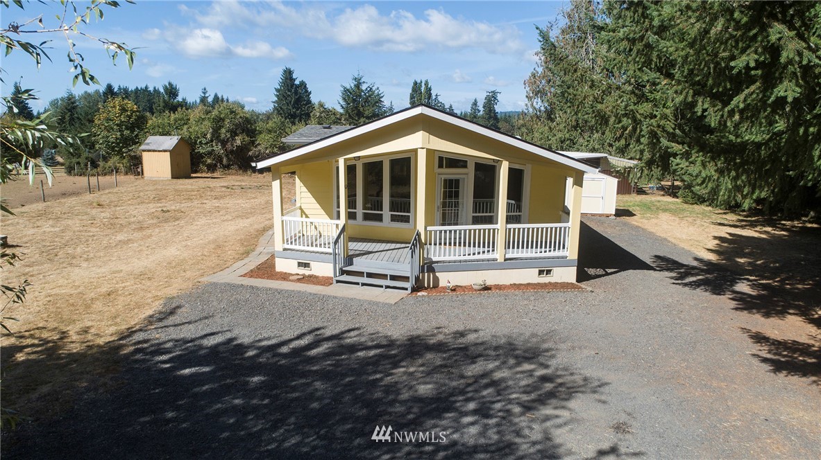 595 Nevil Road Winlock, WA 98596 - Photo 4 of 34 a view of a house with a yard
