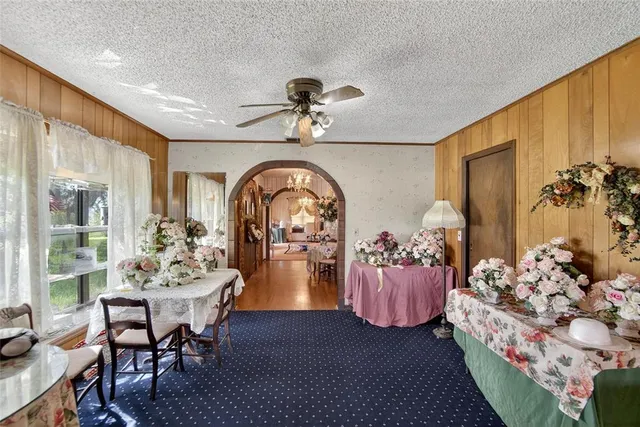a bedroom with furniture and a fireplace