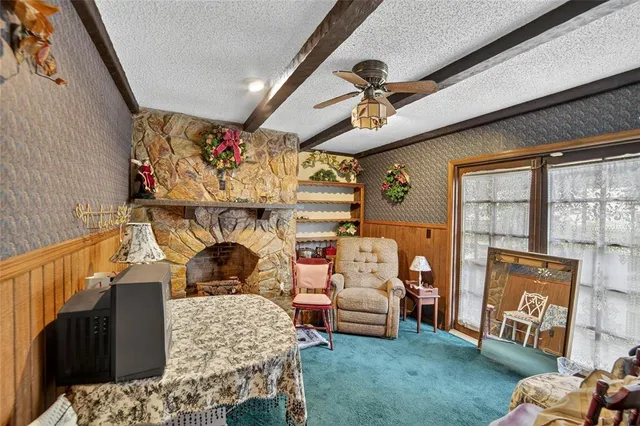 a living room with furniture and a chandelier