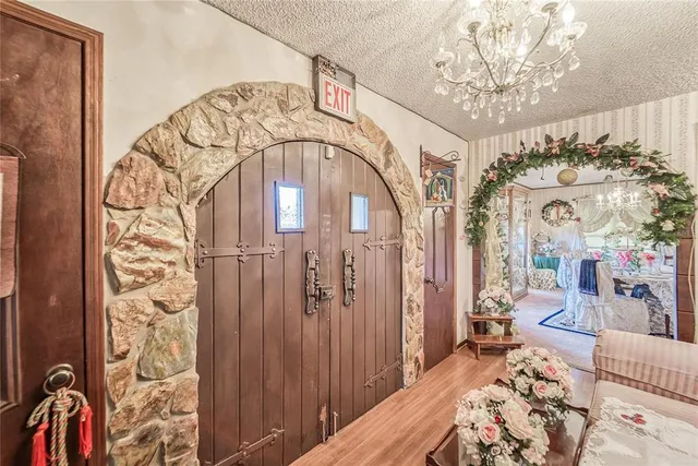 a living room with lots of furniture and wooden floor