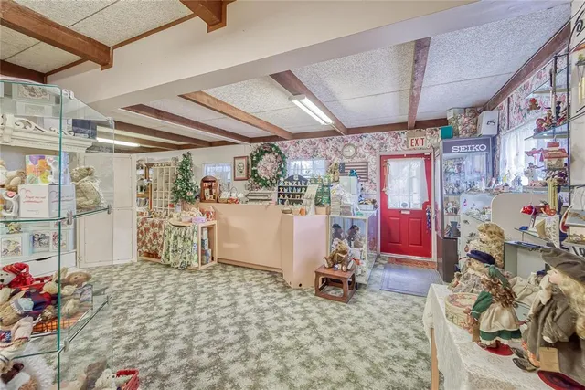 a view of a livingroom with furniture and a flat screen tv