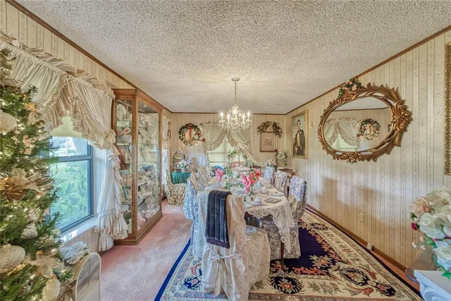 a room with lots of books and a large window