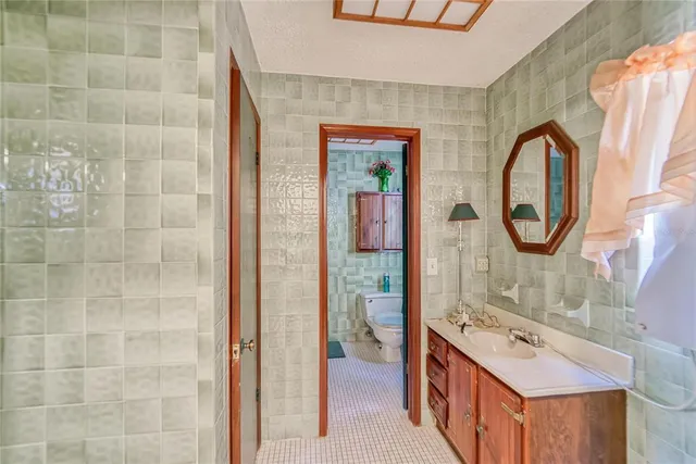 a bathroom with a toilet and shower