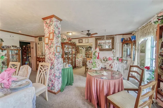 an aerial view of residential house with outdoor space and parking