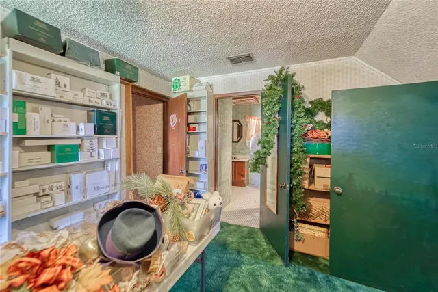 a view of a swimming pool with a yard