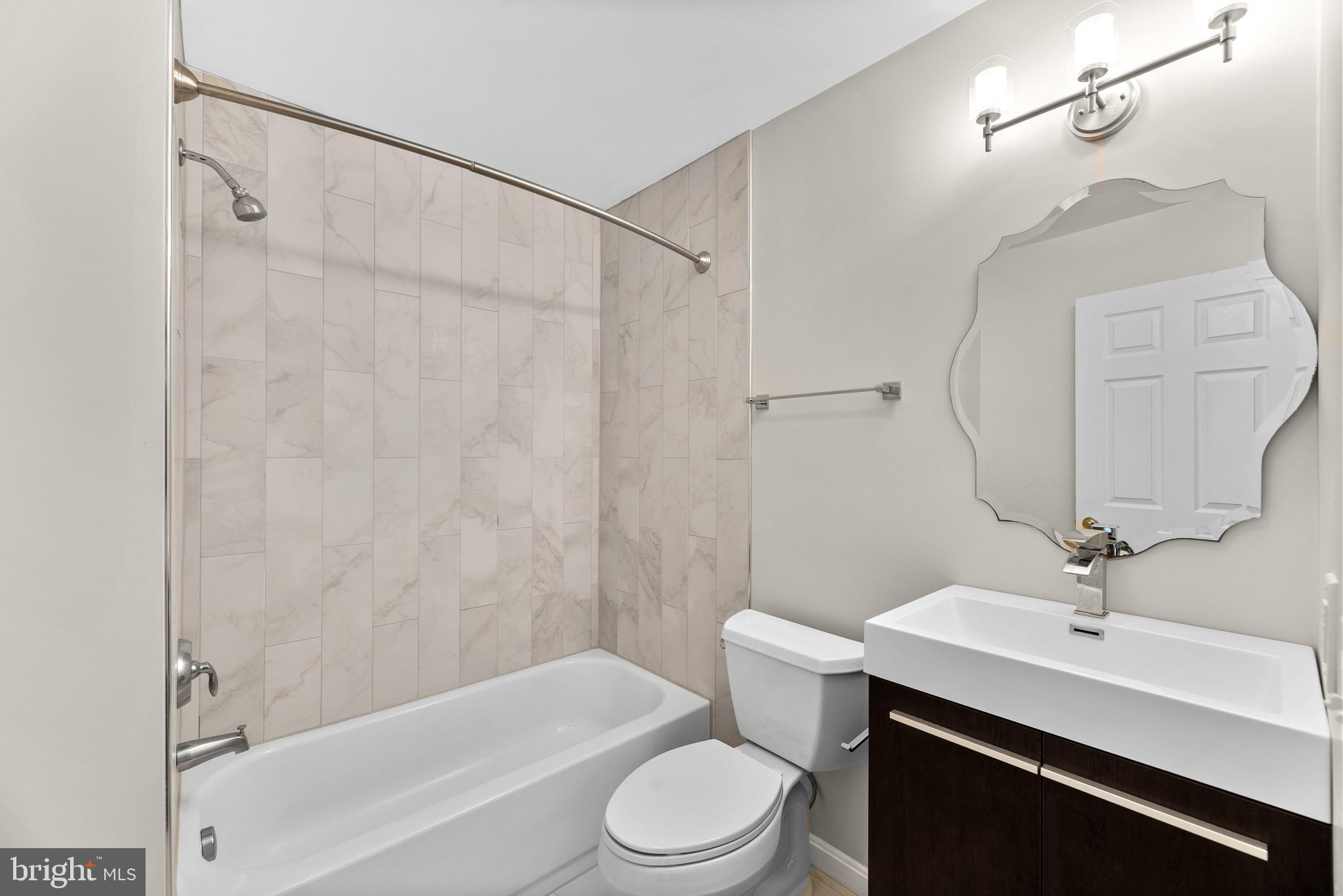 4113 Cadle Creek Road Edgewater, MD 21037 - Photo 19 of 29 Hall bathroom with gorgeous tiled bathtub/shower